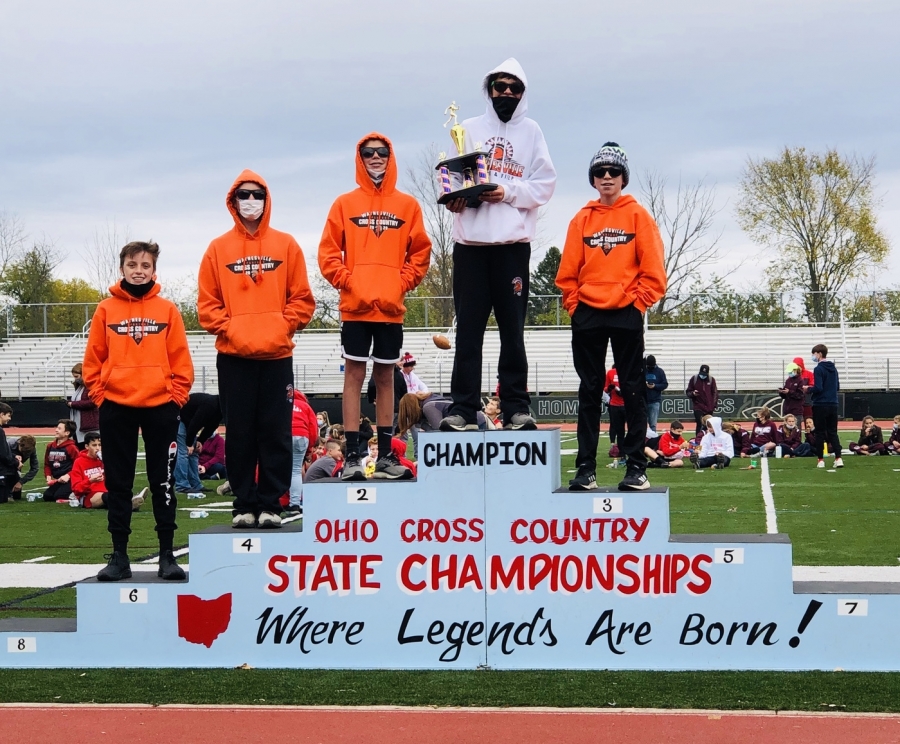 boys on podium for trophy presentation